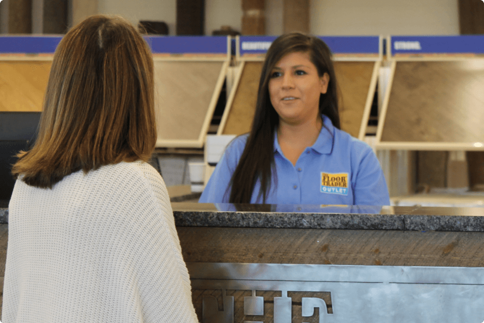 salesperson in flooring store with customer